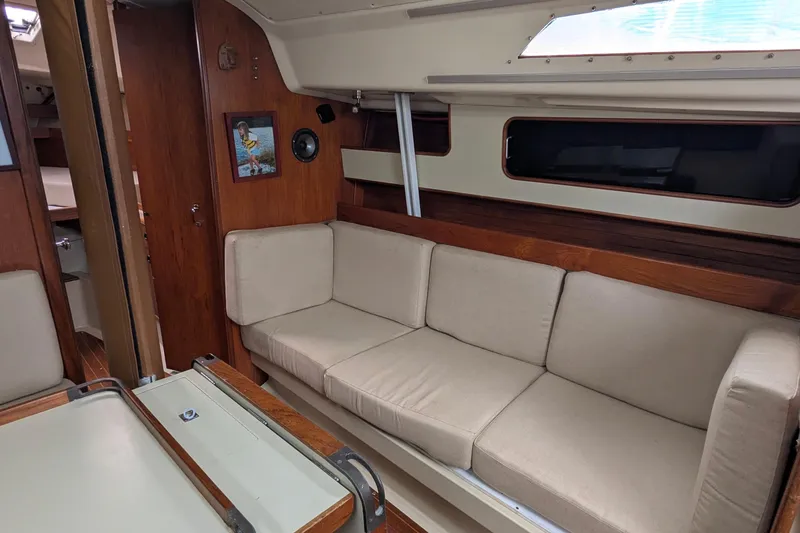 Slide: The Image of Sailboat docked in Seattle, WA, C&C 36 model, 1980, with scenic waterfront view. - 5