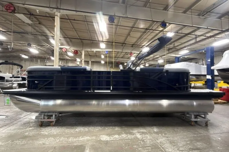 Slide: The Image of 2026 Bennington 23 SSRSF pontoon boat in a factory setting, side view. - 5
