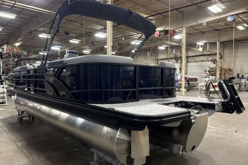 Slide: The Image of 2026 Bennington 23 SSRSF pontoon boat in a factory setting. - 6