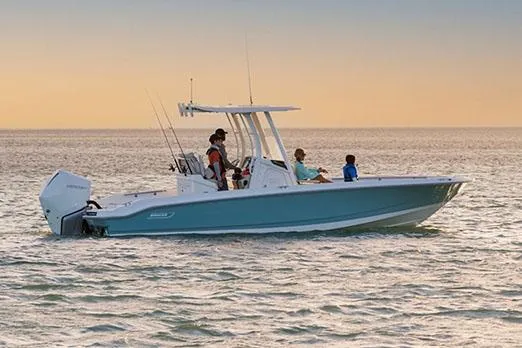 Slide: The Image of Manufacturer Provided Image: 2026 Boston Whaler 250 Dauntless boat cruising on calm water at sunset. - 4