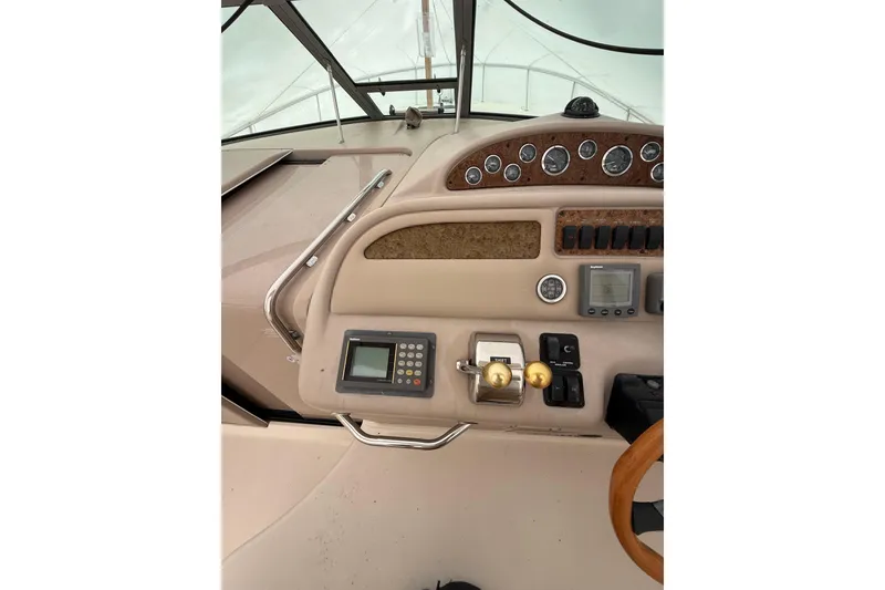 Slide: The Image of Cockpit of 2000 Sea Ray 310 Sundancer with control panel and gauges. - 13