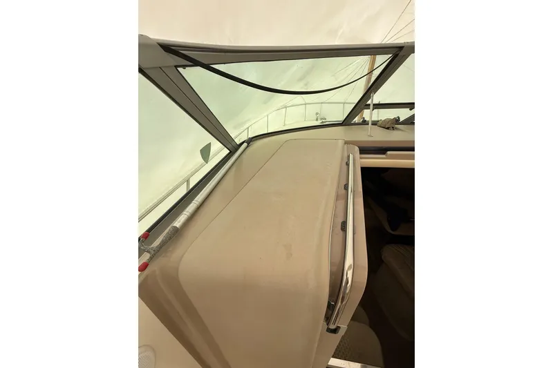 Slide: The Image of 2000 Sea Ray 310 Sundancer boat interior with windshield and dashboard view. - 15