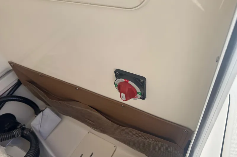 Slide: The Image of Battery switch on 2026 Pioneer 222 Islander boat interior. - 27