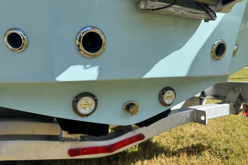 Slide: The Image of 2026 Pioneer 222 Islander boat stern with chrome fittings and trailer. - 31