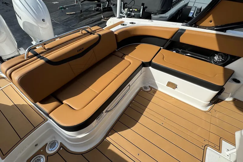 Slide: The Image of 2024 Chaparral 280 OSX boat interior with tan seating and sleek design. - 23