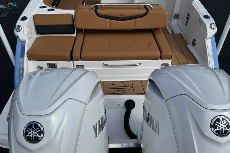 Slide: The Image of 2024 Chaparral 280 OSX boat with Yamaha engines and tan seating. - 29