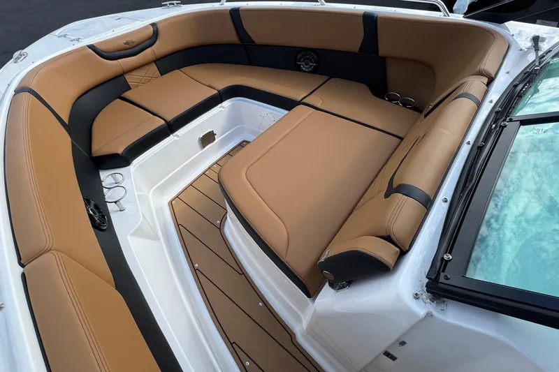 Slide: The Image of Luxurious seating area on 2024 Chaparral 280 OSX boat with tan and black upholstery. - 3