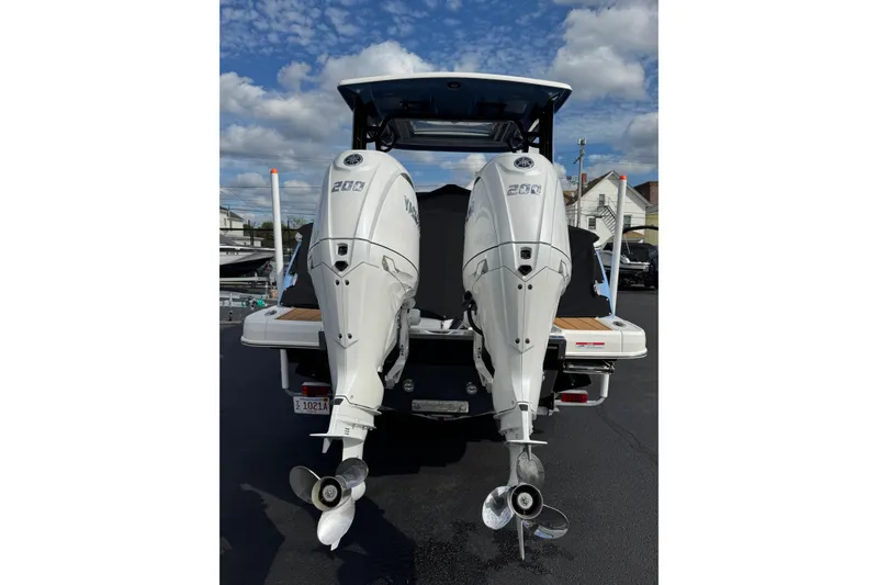 Slide: The Image of 2024 Chaparral 280 OSX boat with dual Yamaha 200 outboard engines, rear view. - 30