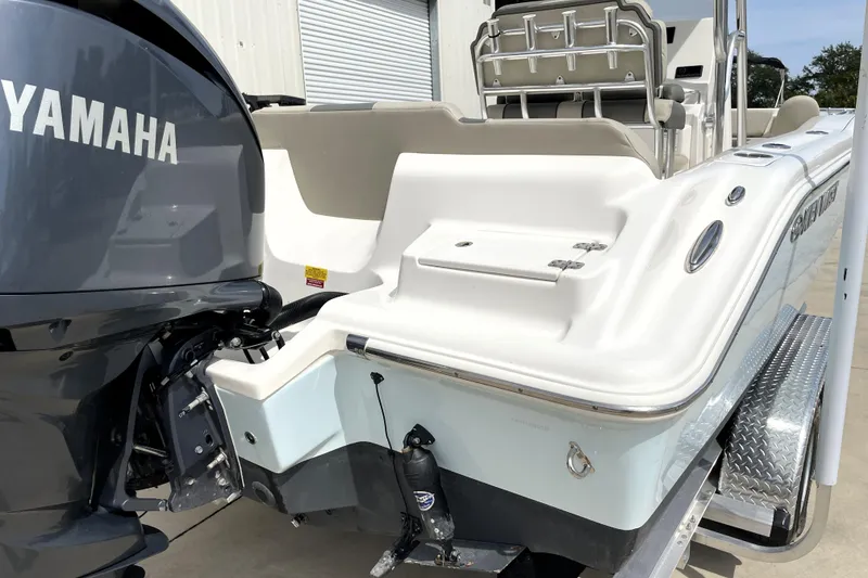 Slide: The Image of 2024 Key West 239 FS boat with Yamaha engine, rear view, on a trailer. - 10