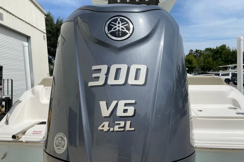 Slide: The Image of 2024 Key West 239 FS boat with 300 V6 4.2L engine, outdoor setting. - 12