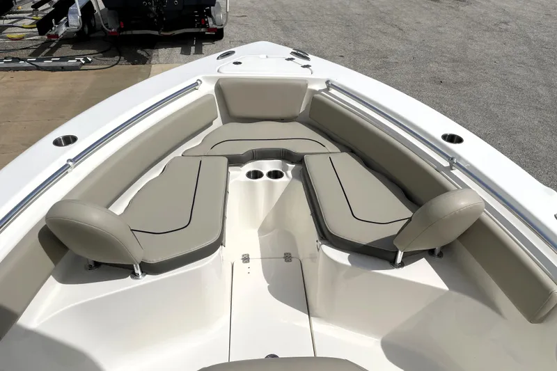 Slide: The Image of 2024 Key West 239 FS boat interior with beige seating and cup holders. - 15