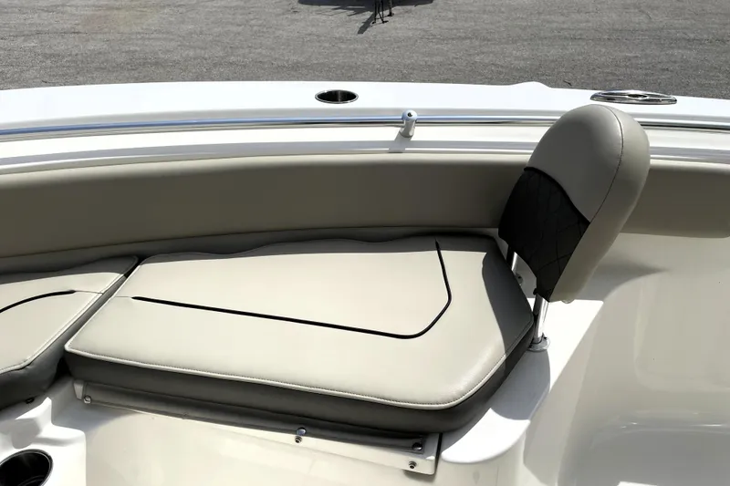 Slide: The Image of 2024 Key West 239 FS boat seating with cushioned backrest and cup holder. - 16