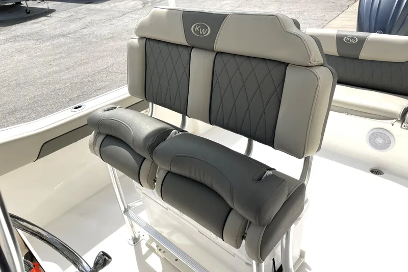 Slide: The Image of 2024 Key West 239 FS boat seating with cushioned backrests and armrests. - 23