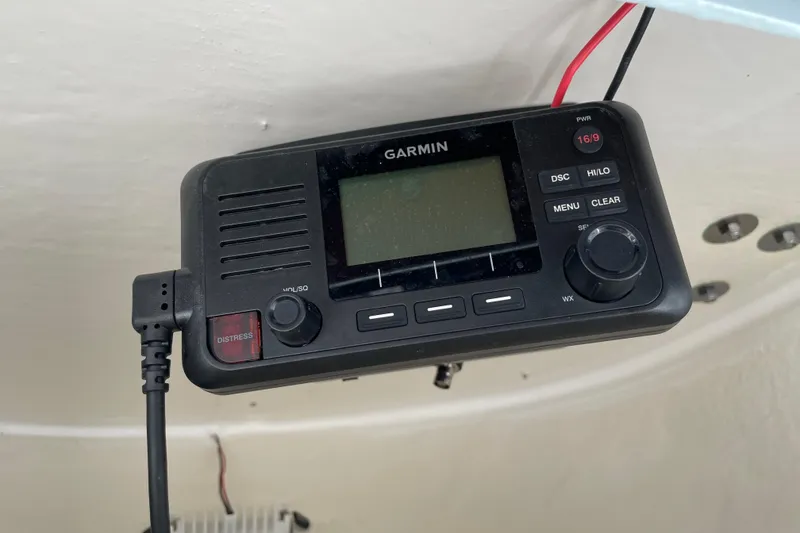Slide: The Image of Garmin marine radio installed on 2024 Key West 239 FS boat, featuring distress button. - 28