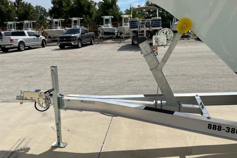 Slide: The Image of Trailer hitch of a 2024 Key West 239 FS boat in a parking lot. - 36
