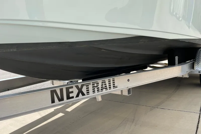 Slide: The Image of 2024 Key West 239 FS boat on NexTrail trailer, close-up view. - 37