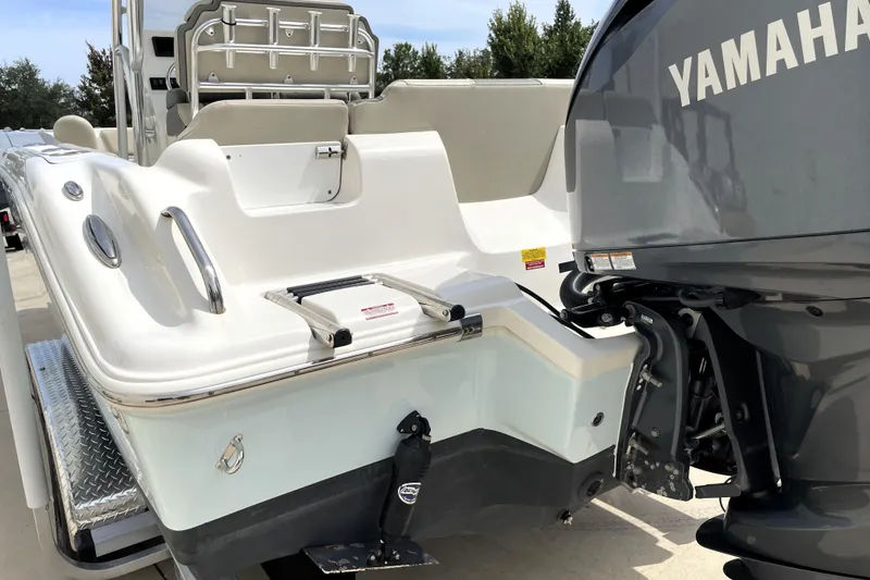 Slide: The Image of 2024 Key West 239 FS boat with Yamaha outboard motor, rear view. - 9
