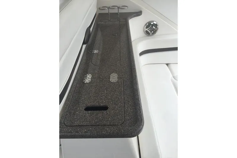 Slide: The Image of 2010 Rinker 400 Express Cruiser interior with sleek countertop and cup holders. - 21