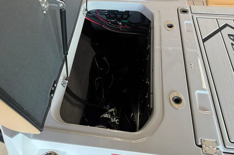 Slide: The Image of Open storage compartment in 2026 Moomba Craz boat, showcasing interior details and wiring. - 11