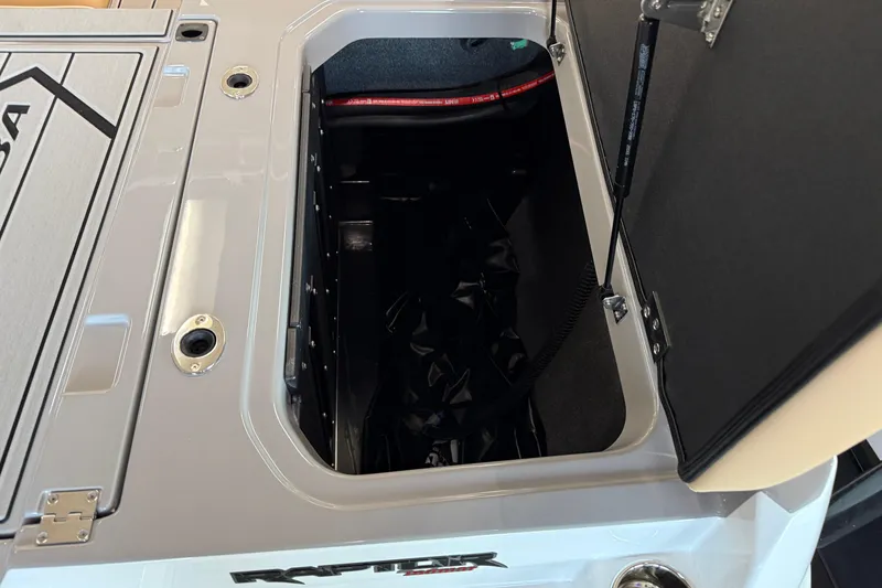 Slide: The Image of 2026 Moomba Craz boat storage compartment with open hatch and visible interior. - 12