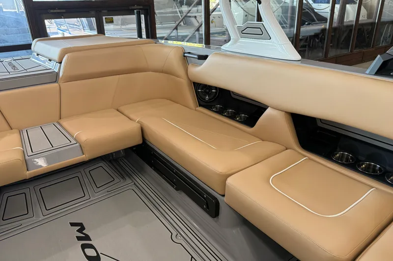 Slide: The Image of 2026 Moomba Craz boat interior with tan seating and modern design elements. - 16