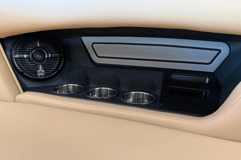 Slide: The Image of 2026 Moomba Craz interior detail with speaker and cup holders. - 17