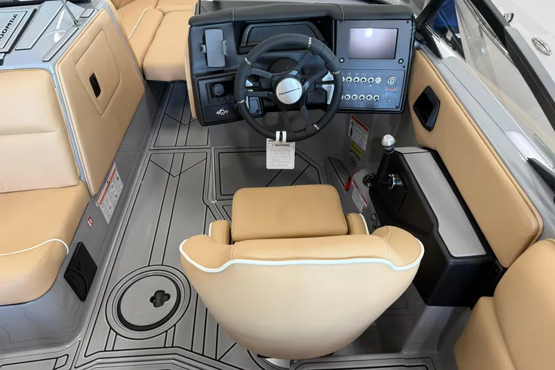 Slide: The Image of 2026 Moomba Craz boat interior with tan seating and modern dashboard controls. - 21