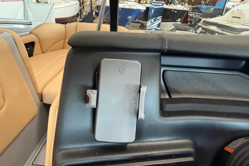 Slide: The Image of 2026 Moomba Craz interior with wireless phone charger and tan seating. - 23
