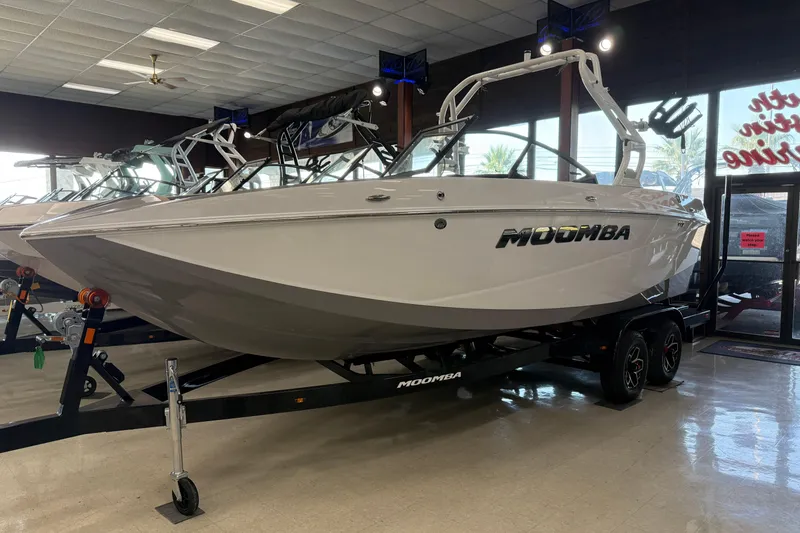 Slide: The Image of Steering wheel of 2026 Moomba Craz boat with control buttons and dashboard. - 25