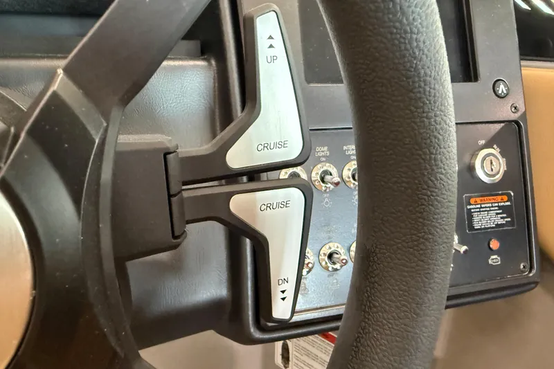 Slide: The Image of Steering wheel controls of 2026 Moomba Craz boat, featuring cruise control buttons. - 27