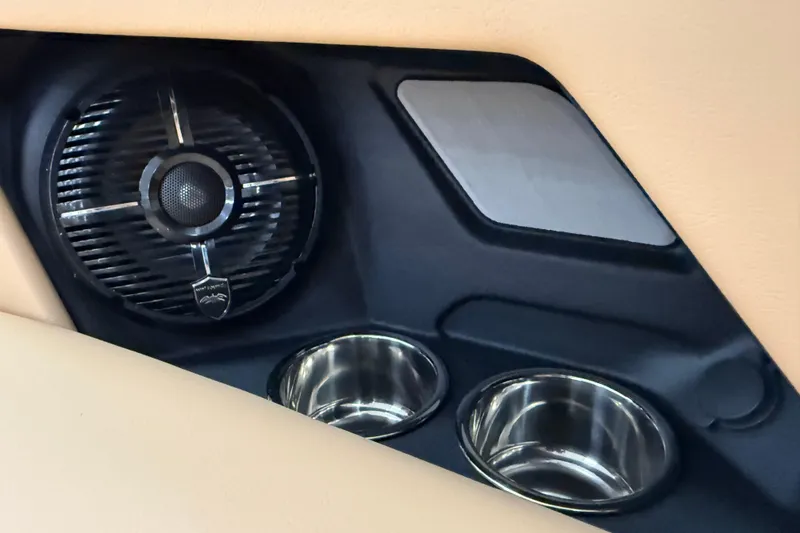 Slide: The Image of 2026 Moomba Craz interior speaker and cup holders in beige and black design. - 36