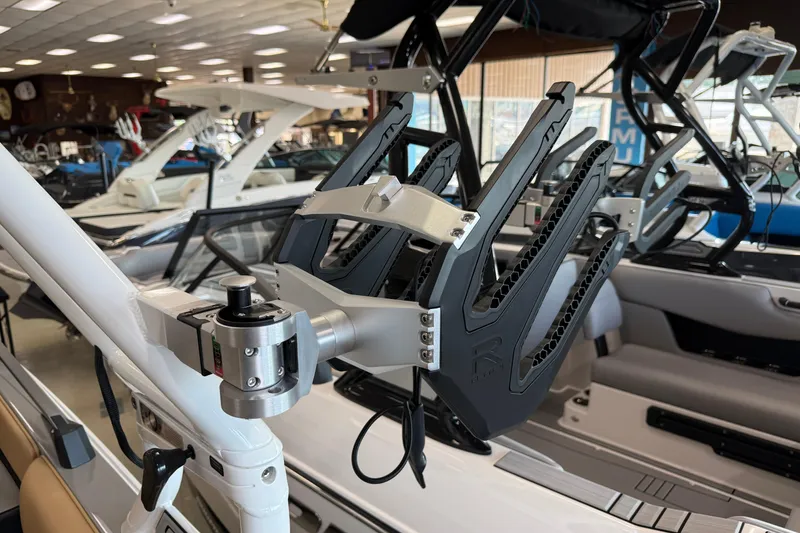 Slide: The Image of 2026 Moomba Craz boat with advanced wakeboard rack in showroom. - 39