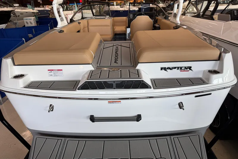 Slide: The Image of 2026 Moomba Craz boat with tan seating and Raptor Indmar engine. - 9