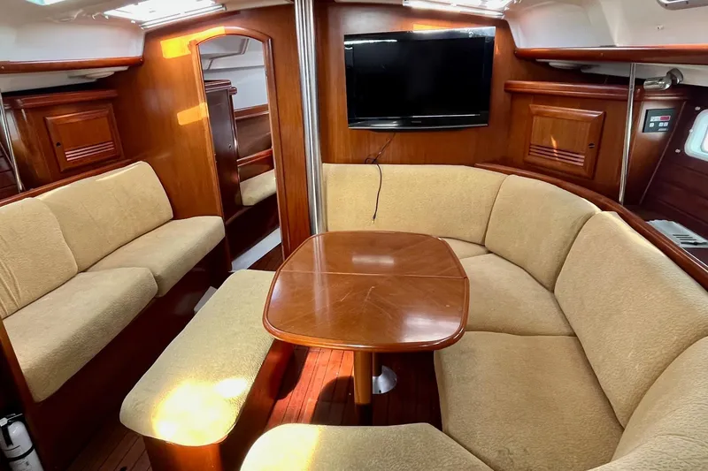 Slide: The Image of Beige cushioned seating inside a 2006 Beneteau Oceanis Clipper 423 yacht. - 12