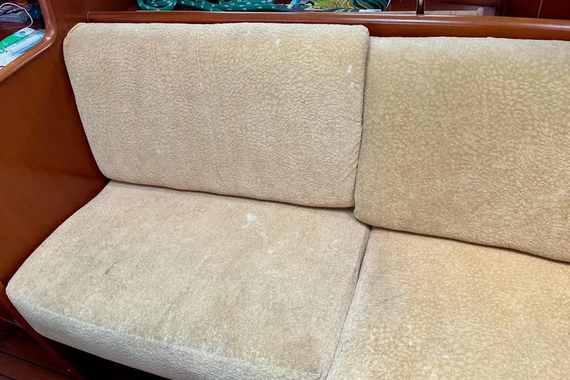 Slide: The Image of 2006 Beneteau Oceanis Clipper 423 navigation station with control panel and communication equipment. - 13