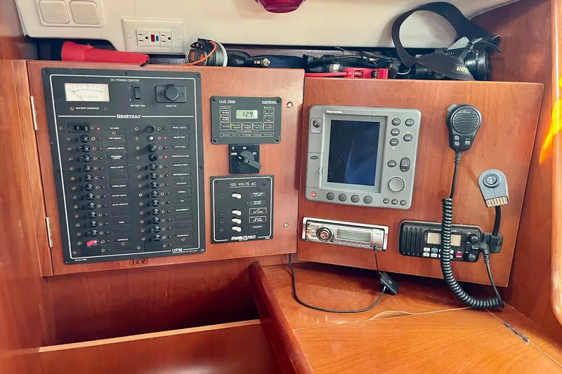 Slide: The Image of Galley of 2006 Beneteau Oceanis Clipper 423 with stove, microwave, and wooden cabinetry. - 15