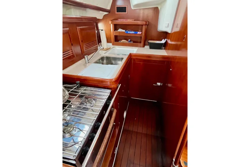 Slide: The Image of Open fridge with glass shelves inside a 2006 Beneteau Oceanis Clipper 423 yacht. - 17