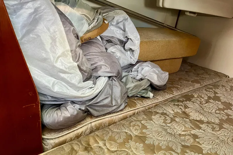 Slide: The Image of Engine compartment of 2006 Beneteau Oceanis Clipper 423 sailboat, featuring batteries and mechanical components. - 22