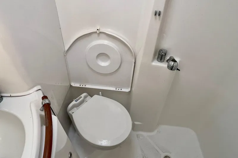 Slide: The Image of Bathroom interior of 2006 Beneteau Oceanis Clipper 423 yacht, featuring sink and toilet. - 26