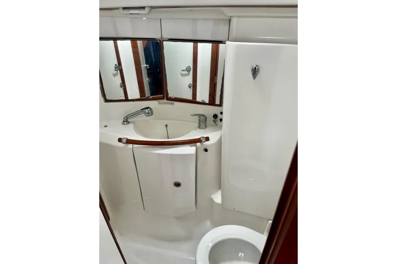 Slide: The Image of Bathroom interior of 2006 Beneteau Oceanis Clipper 423 yacht, featuring sink and mirrors. - 35