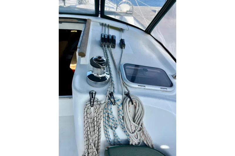 Slide: The Image of 2006 Beneteau Oceanis Clipper 423 sailboat docked at marina, clear blue sky. - 6