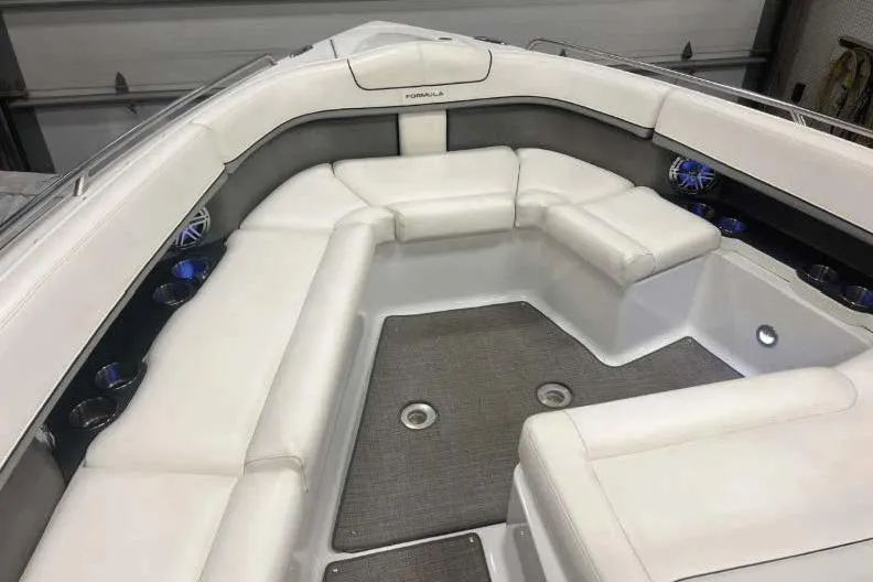 Slide: The Image of 2015 Formula 350 Crossover Bowrider with spacious white seating and modern interior design. - 10