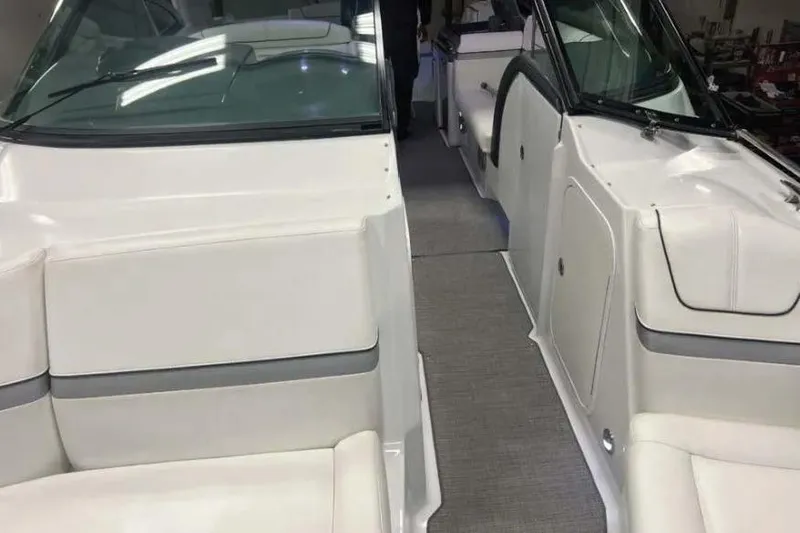 Slide: The Image of 2015 Formula 350 Crossover Bowrider interior with white seating and sleek design. - 4