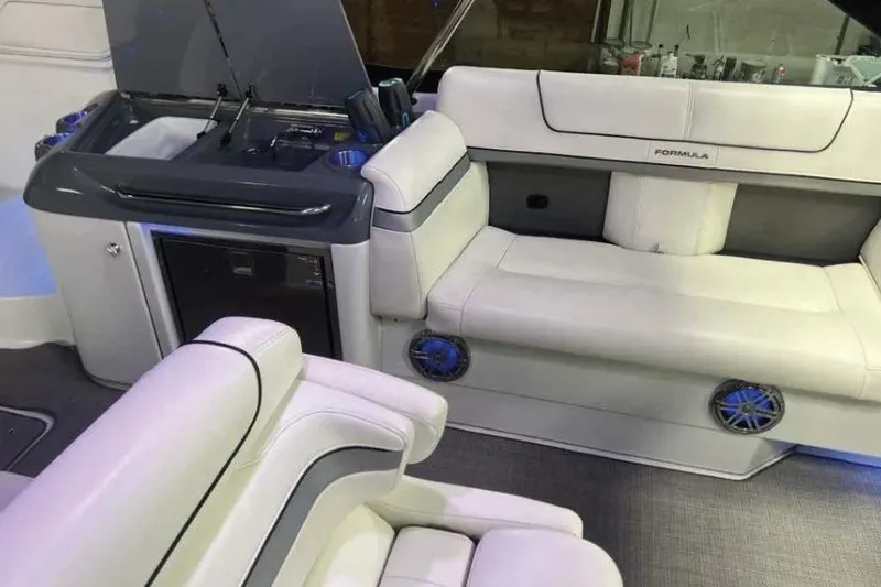 Slide: The Image of 2015 Formula 350 Crossover Bowrider interior with white seating and kitchenette. - 5