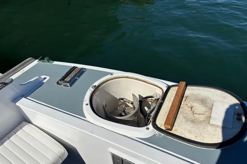 Slide: The Image of Open hatch on 1985 Jarvis Newman 36 boat, revealing anchor storage. - 11