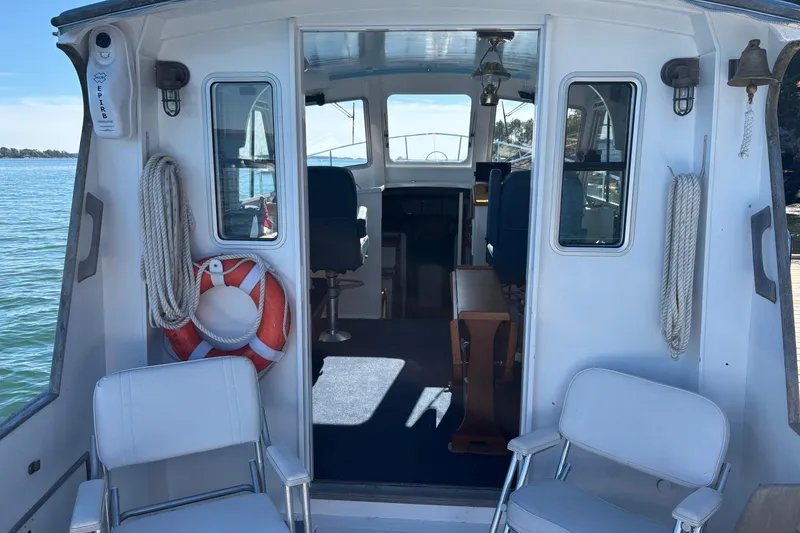 Slide: The Image of Interior view of 1985 Jarvis Newman 36 boat with seating and life preserver. - 12