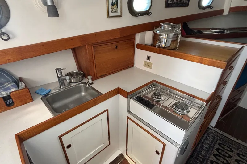 Slide: The Image of Compact galley kitchen in 1985 Jarvis Newman 36 boat with stove and sink. - 25