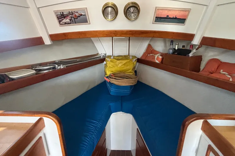 Slide: The Image of Interior of 1985 Jarvis Newman 36 boat with blue cushions and nautical decor. - 30