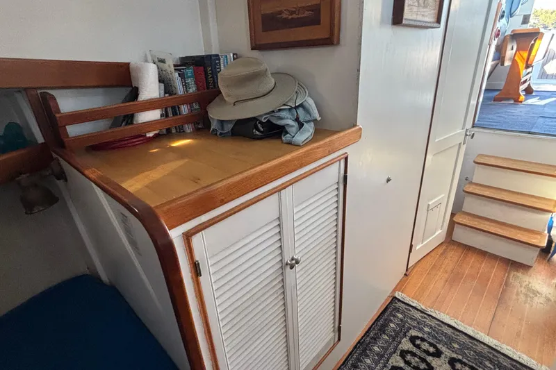 Slide: The Image of Interior of 1985 Jarvis Newman 36 boat with wooden cabinetry and stairs. - 32