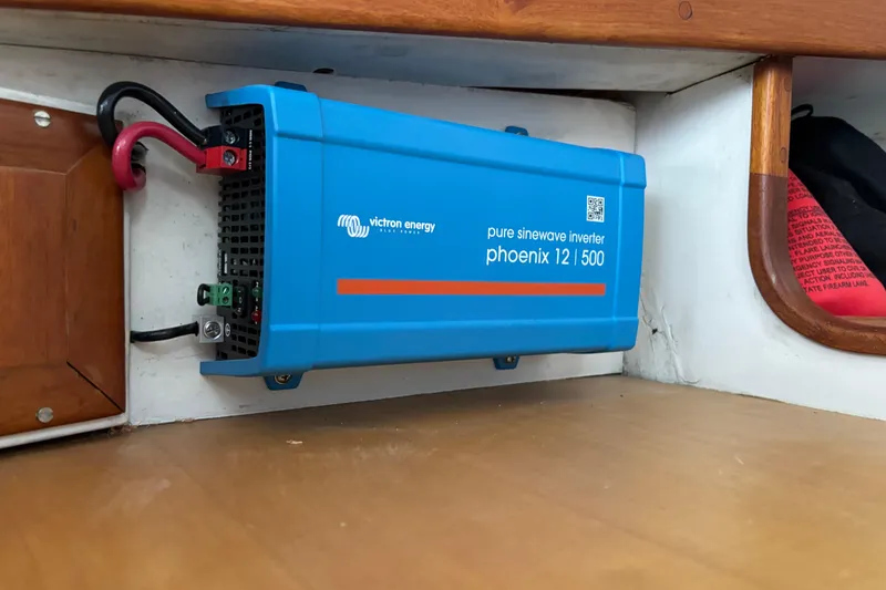 Slide: The Image of Blue Victron Energy inverter installed on 1985 Jarvis Newman 36 boat interior. - 34